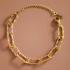Gold chain bracelet on a brown background