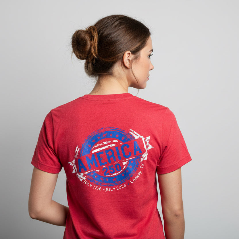 Person wearing a red t-shirt with 'AMERICA 250' design on the back, standing against a plain background.