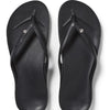 Pair of black sandals with a rhinestone on a white background