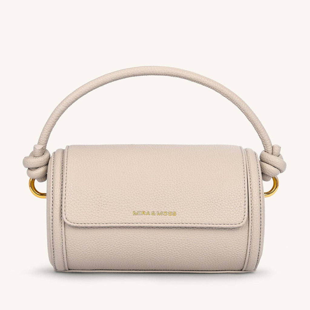 Beige handbag with a handle on a white background