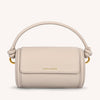 Beige handbag with a handle on a white background