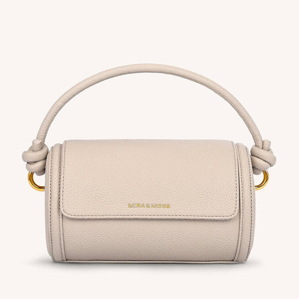Beige handbag with a handle on a white background