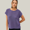 Woman wearing a purple t-shirt against a white background