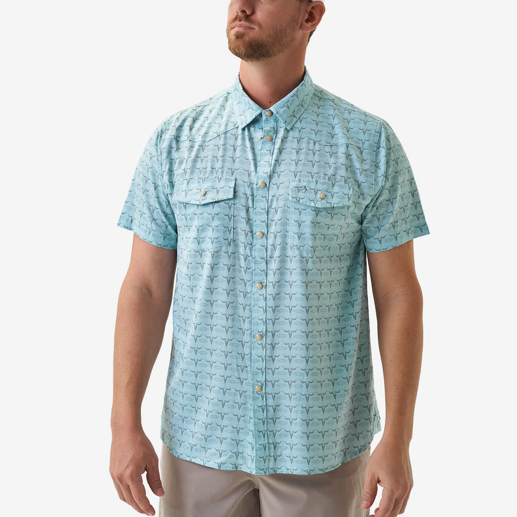 Man wearing a light blue patterned shirt on a white background