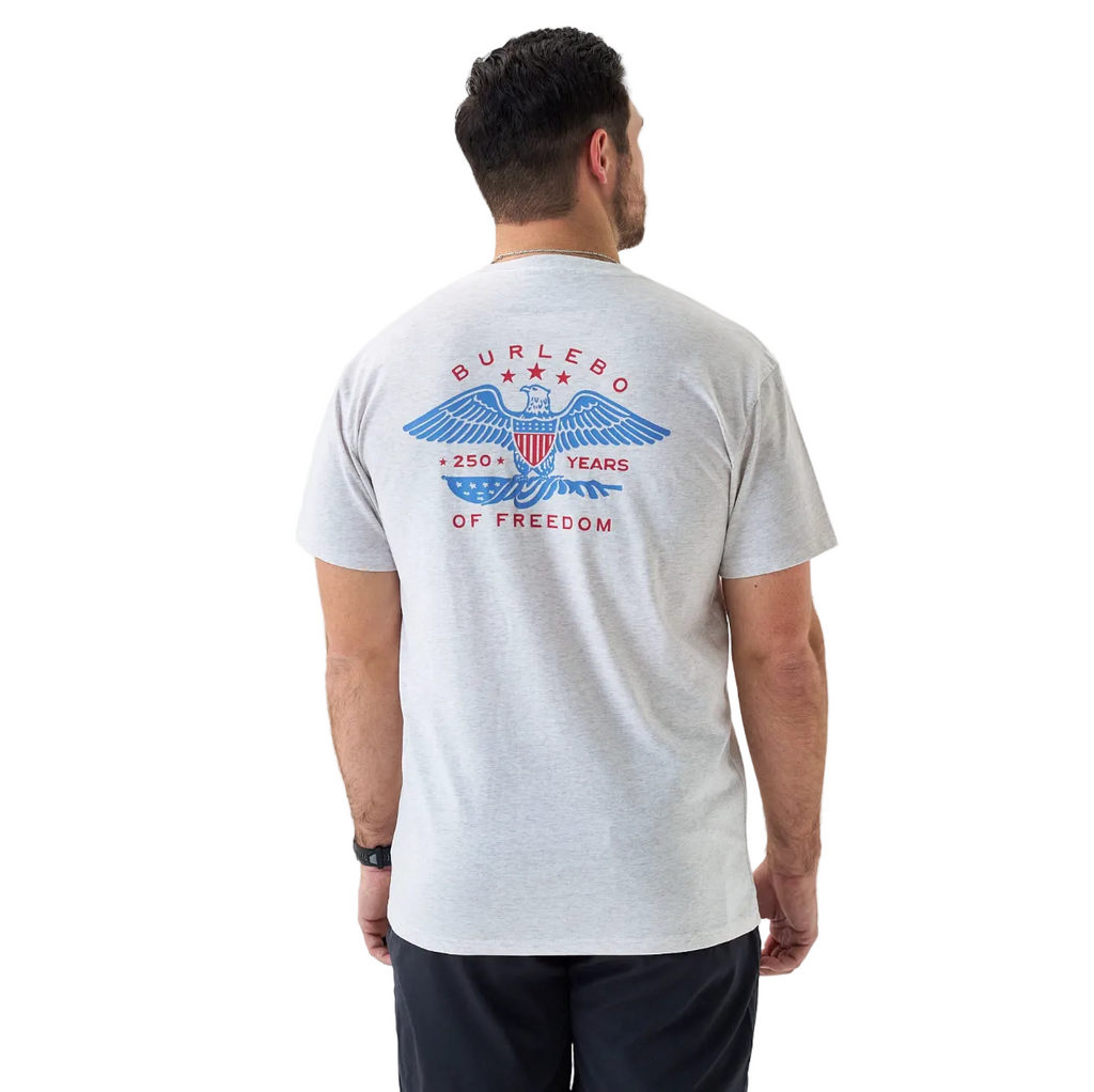 Man wearing a white t-shirt with a graphic design on the back, standing against a white background