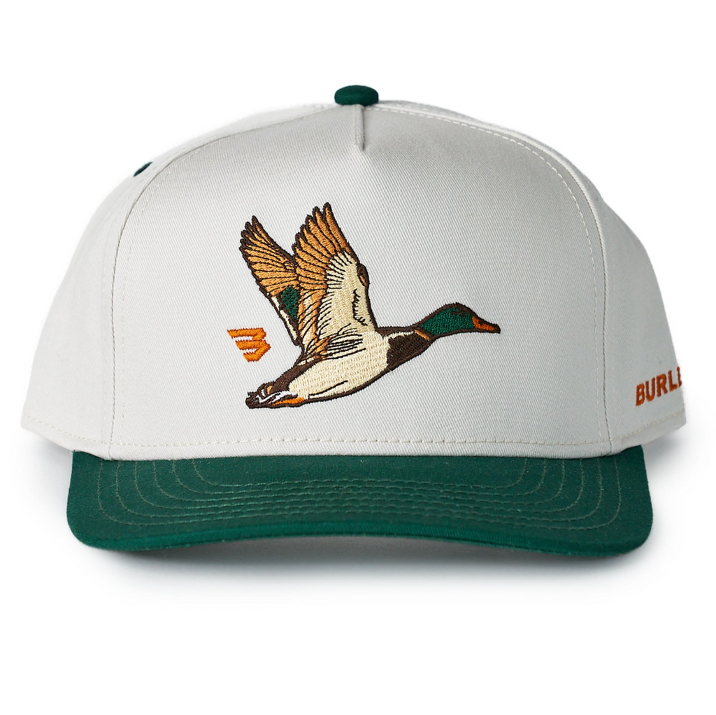 White cap with green brim featuring a duck design and Burlap branding on a white background