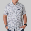 A man wearing a short-sleeve button-up shirt with a gray and white abstract camouflage pattern, featuring a chest pocket with a black logo tab.