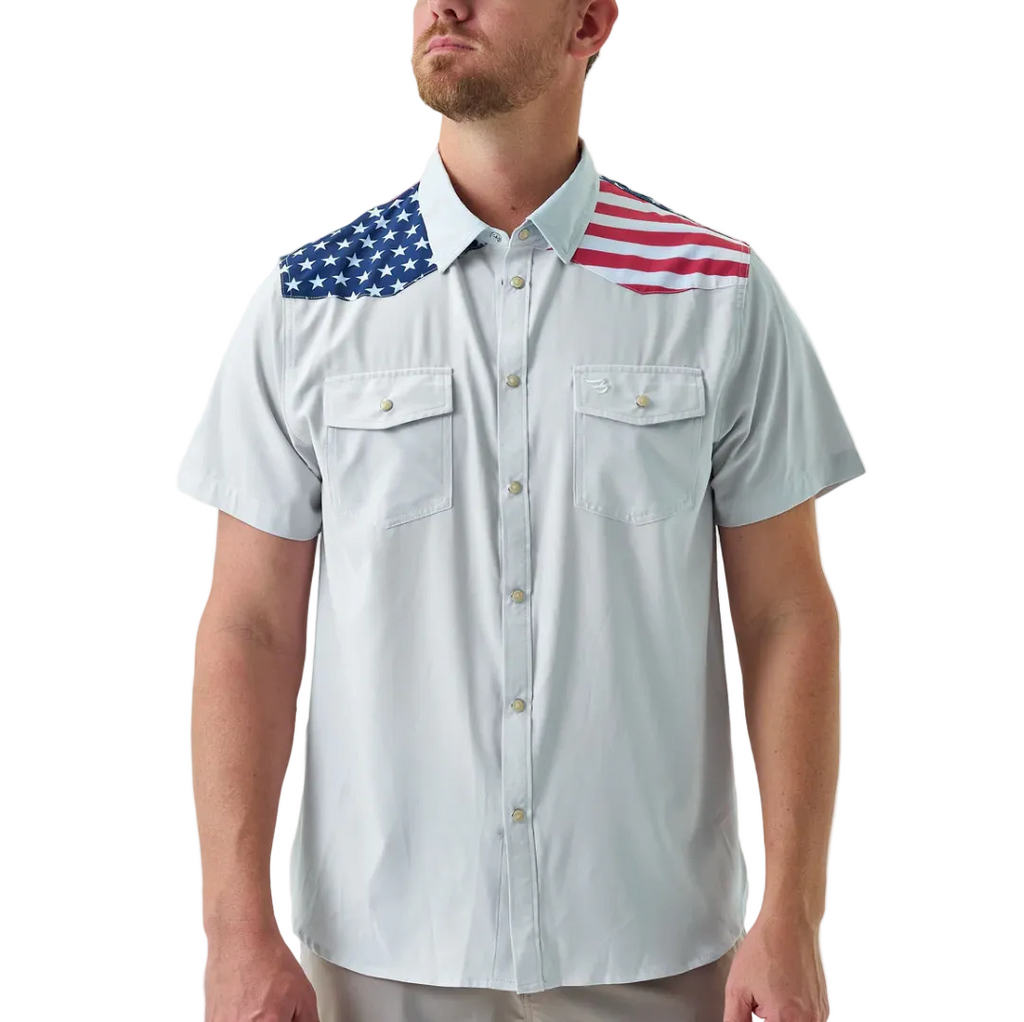 Man wearing a white shirt with American flag designs on the shoulders against a white background