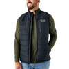 Man wearing a black puffer vest over an olive green shirt on a white background