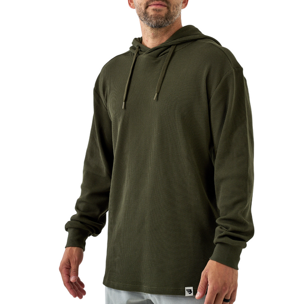 Man wearing a green hoodie on a white background