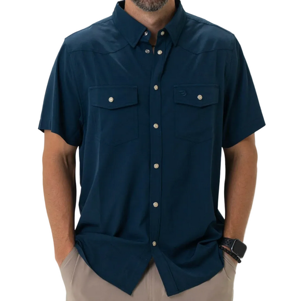 Man wearing a navy blue short-sleeve shirt with button details on a white background