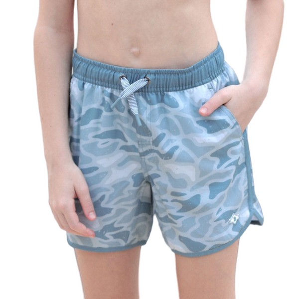 Blue camouflage shorts worn by a person on a white background