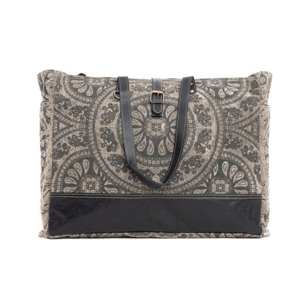 Patterned tote bag with black accents on a white background
