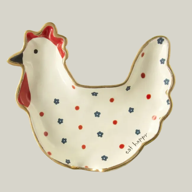 Chicken-shaped ceramic dish with polka dot pattern on a neutral background