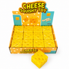 Box of cheese squishy toys with a single toy in front on a white background