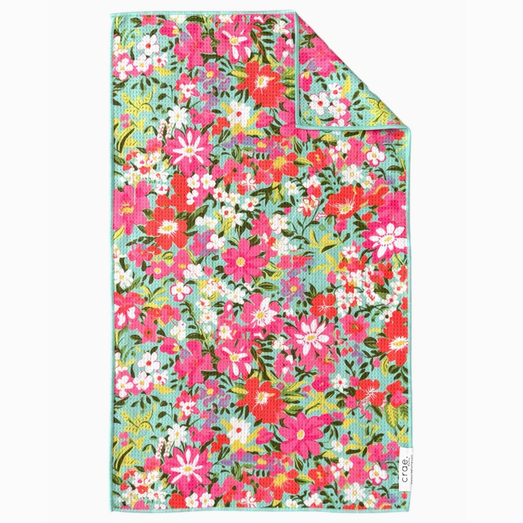 Floral patterned fabric with pink, red, and green colors on a white background
