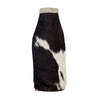Black and white cowhide bottle cover on a white background