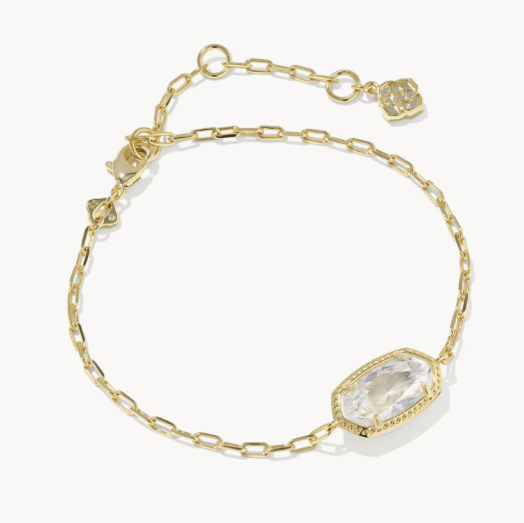 Gold bracelet with clear gemstones on a white background