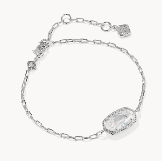 Silver bracelet with a large clear gemstone on a white background