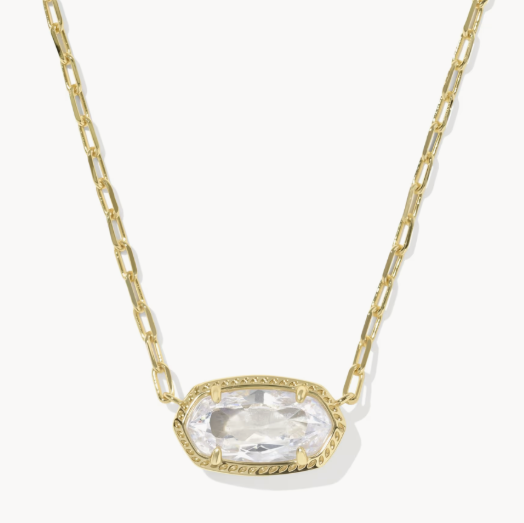 Gold necklace with a clear gemstone pendant on a white background