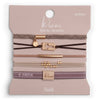 Set of hair tie and bracelets on a 'klari' branded card with various designs and colors.