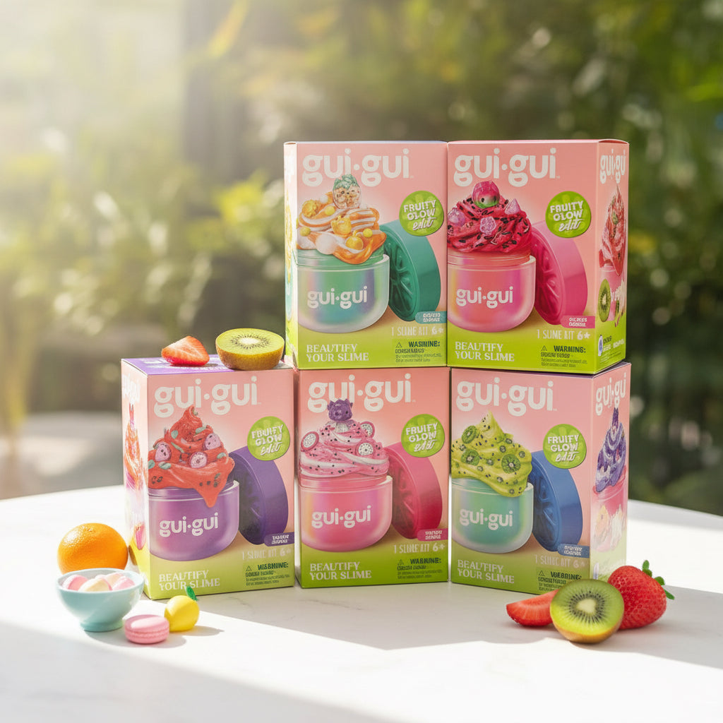Six boxed gui-gui Beautyify Your Slime Fruitly Glow Ball kits arranged in two rows.