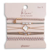 Set of hair ties and bracelets on a 'klari' branded card with 'glimmer' text.