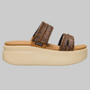 Leopard print platform sandal on a beige background