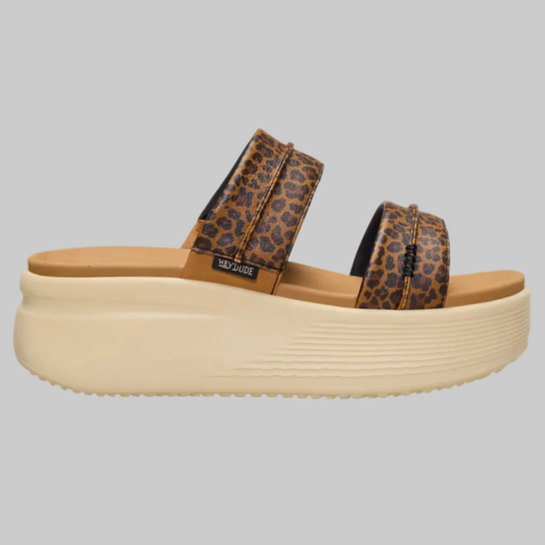 Leopard print platform sandal on a beige background