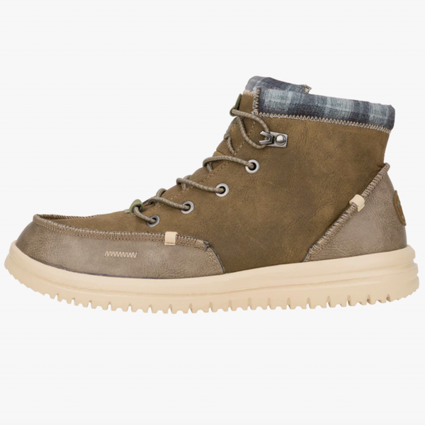 Brown hiking boot with plaid lining on a white background
