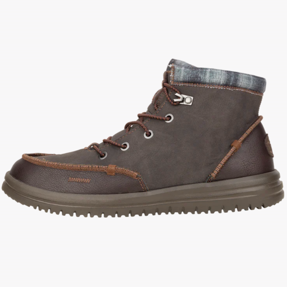 Brown leather boot with plaid lining on a white background