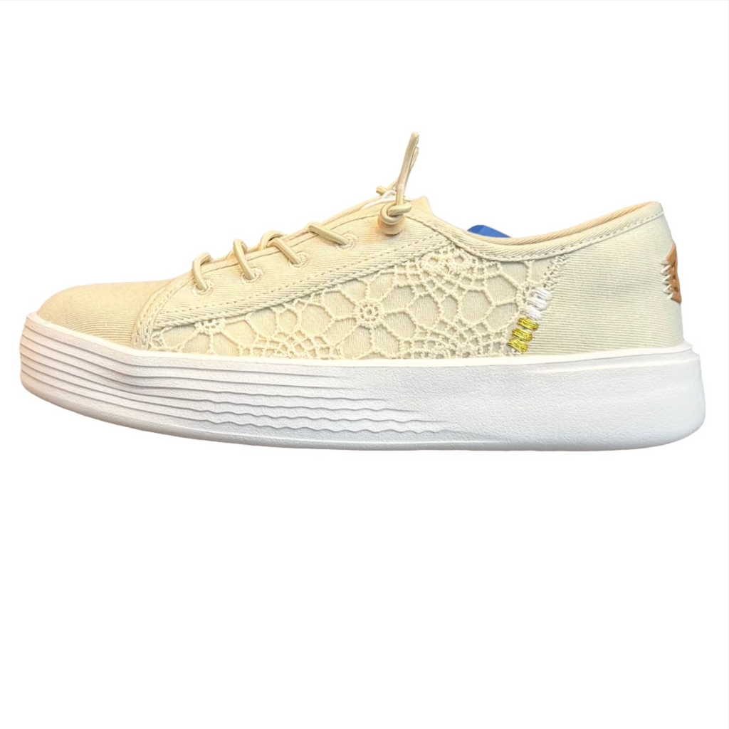 Beige lace-up sneaker on a white background