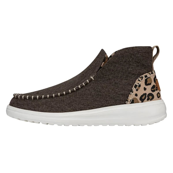 Brown slip-on shoe with leopard print accent on a white background