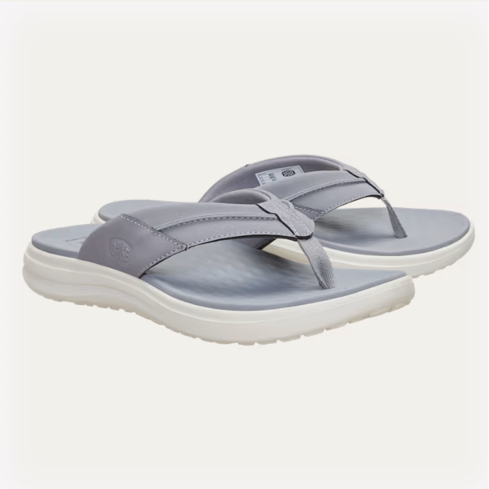 Gray sandals with white soles on a light gray background