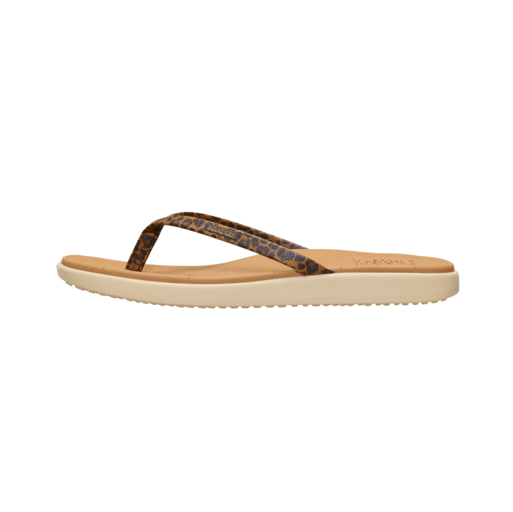Beige sandal with a patterned strap on a white background