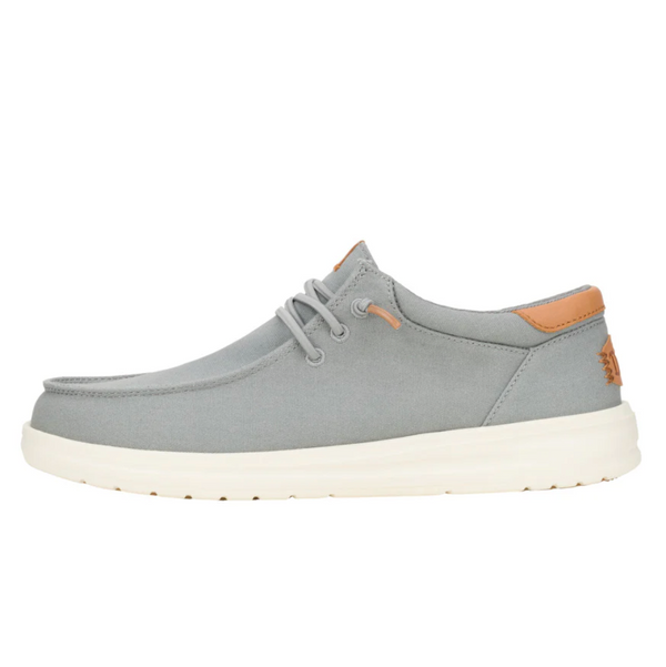 Gray casual shoe with brown accents on a white background