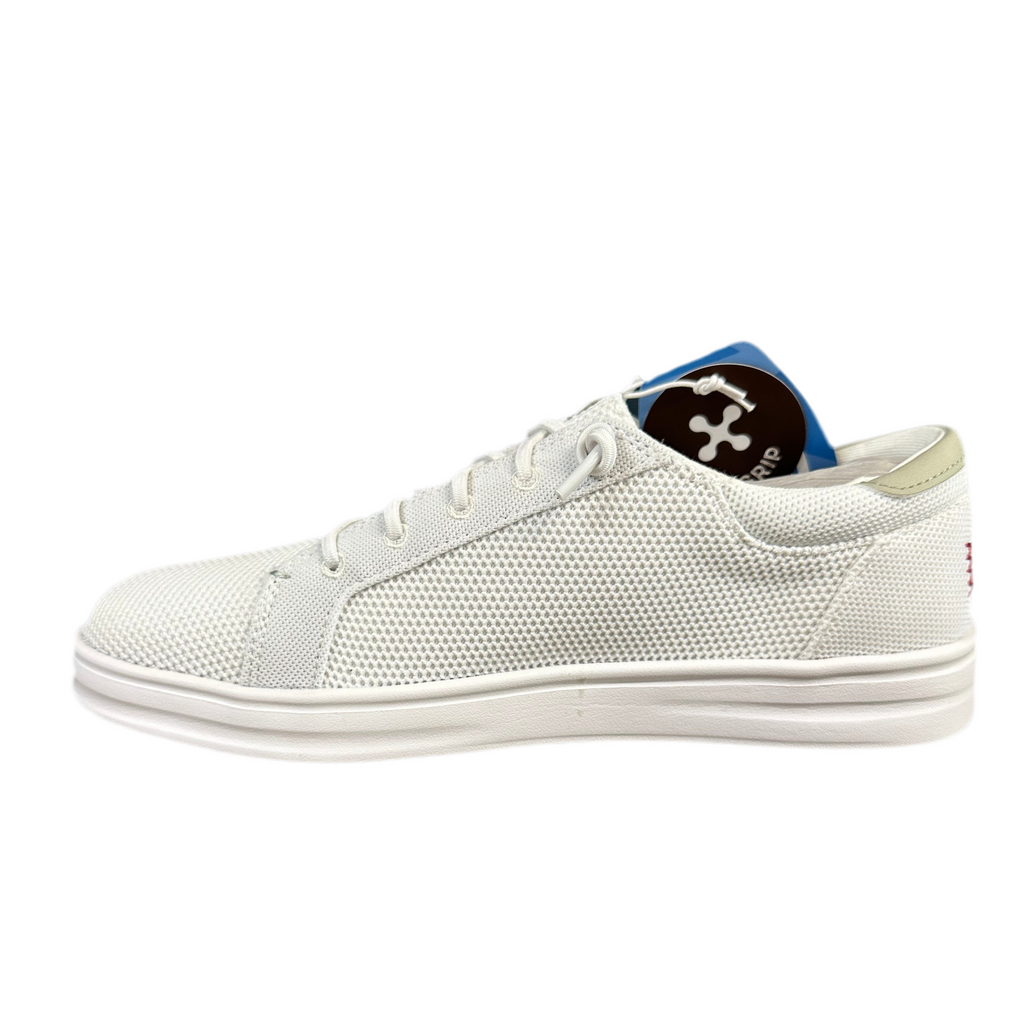 White sneaker with red accents on a white background