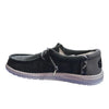 Black casual shoe with white sole on a white background