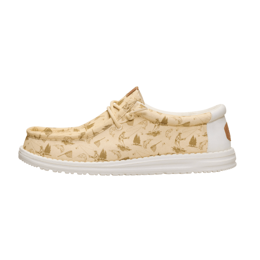 Beige patterned shoe with white sole on a white background
