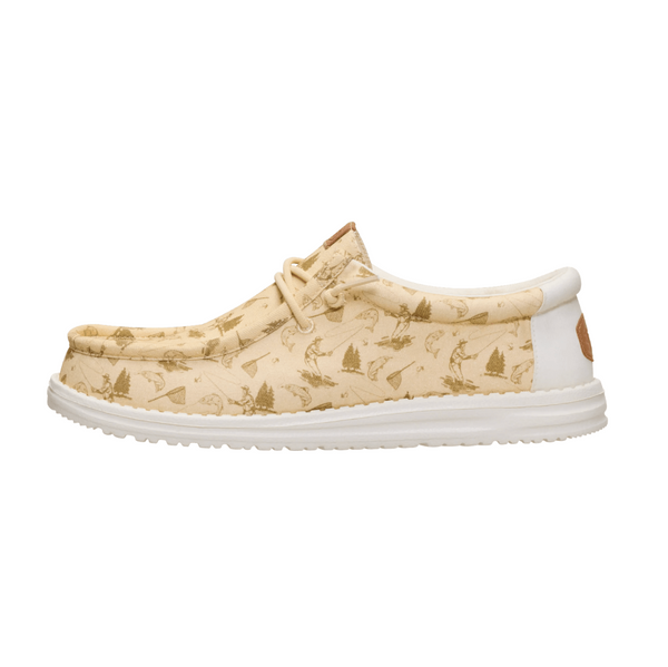 Beige patterned shoe with white sole on a white background
