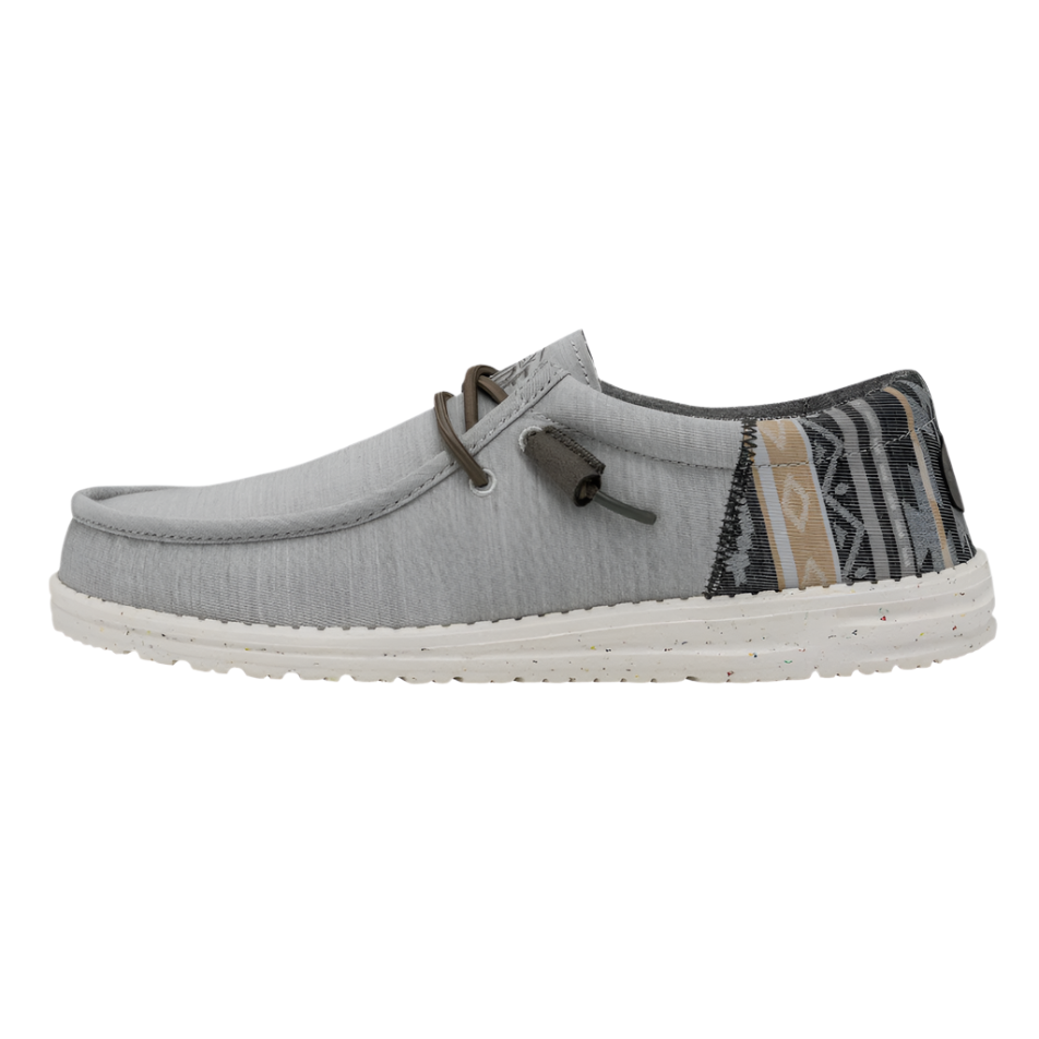 Gray casual shoe with patterned sole on a white background