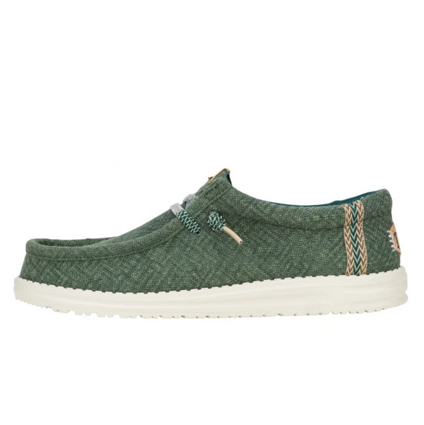Green casual shoe with white sole on a white background