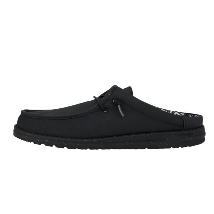 Black slip-on shoe on a white background