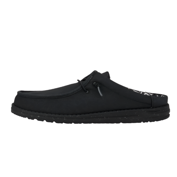 Black slip-on shoe on a white background