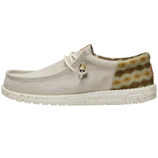 Light gray shoe with patterned heel on a white background
