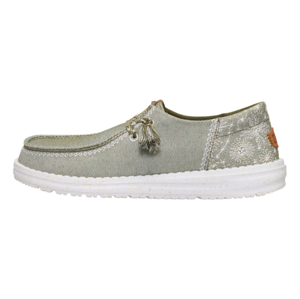 Green casual shoe with white sole on a white background