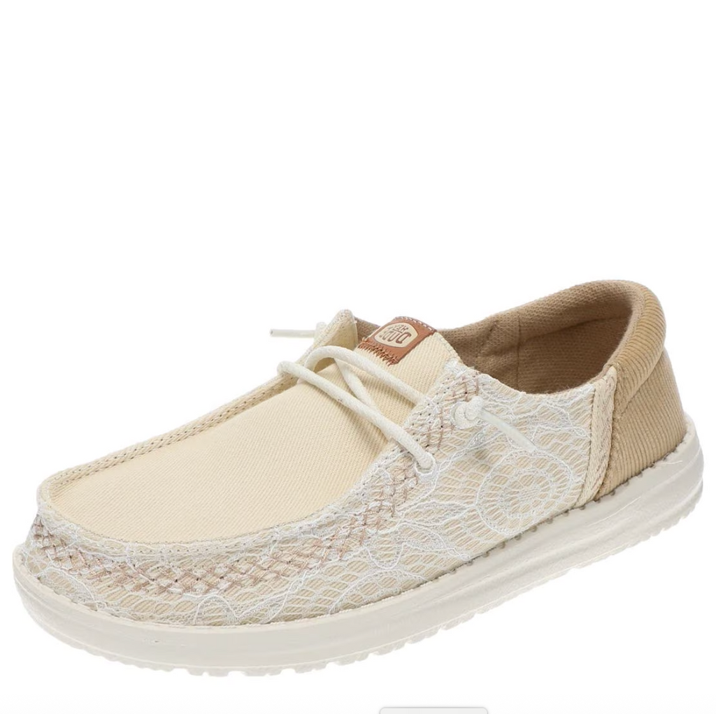 Beige and brown shoe with white laces on a white background