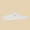 White fluffer slip on on beige background