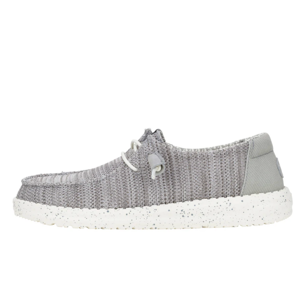 Gray knit shoe with white sole on a white background