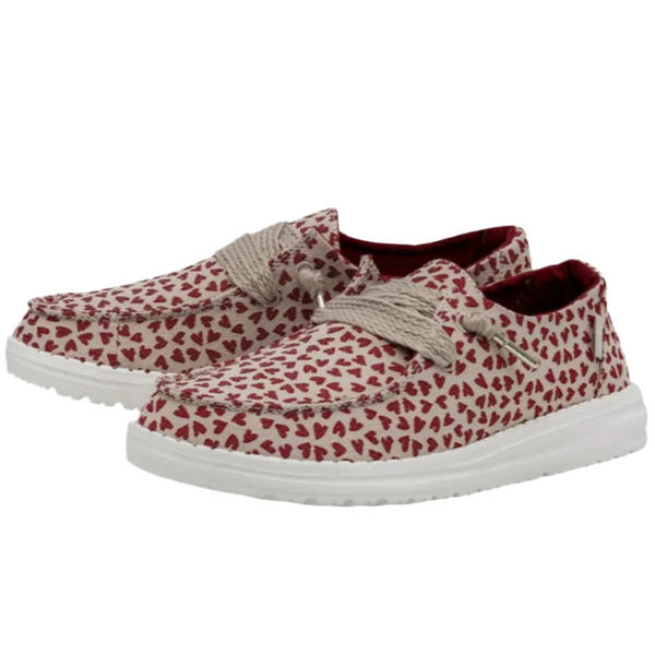 Red and white patterned shoes with white soles on a white background